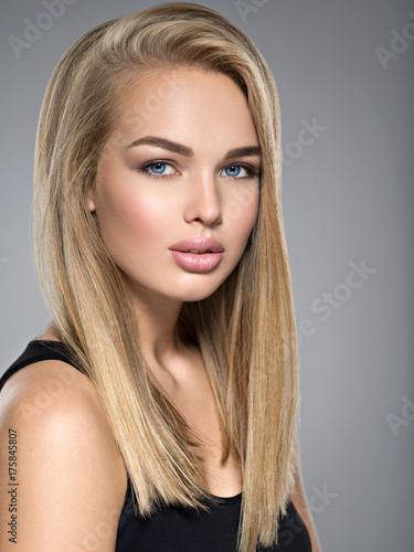 Beautiful young woman with long straight hairs