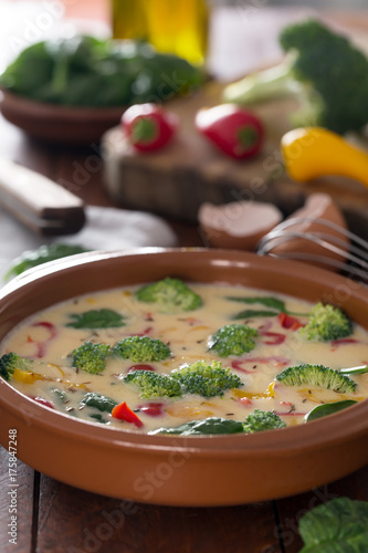 Fresh raw omelette prepared with vegetables and spinach