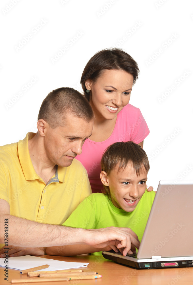 Parents and son using modern laptop Parents and son using modern laptop