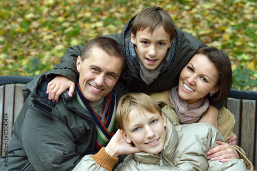  family posing in park 