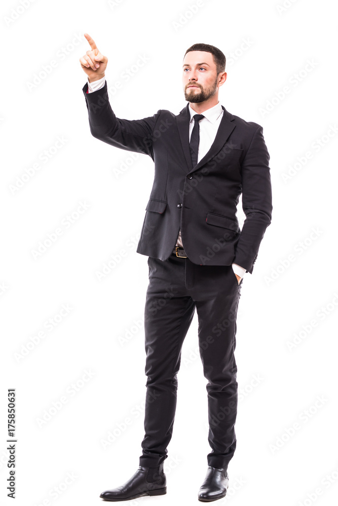 Full length of young business man in suit pointing at copy space over white background Full length of young business man in suit pointing at copy space over white background