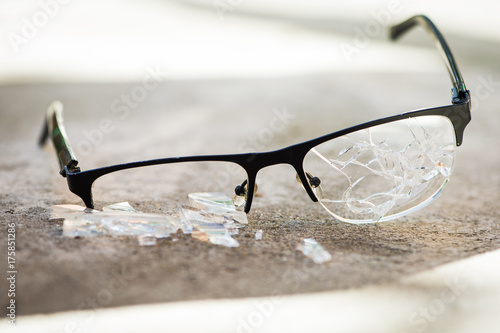 Fototapeta Naklejka Na Ścianę i Meble -  broken glasses on the asphalt