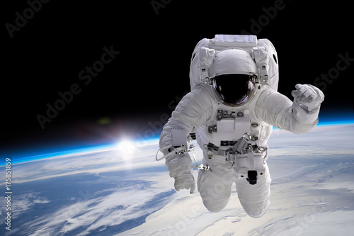 Fototapeta Naklejka Na Ścianę i Meble -  Astronaut at spacewalk. Elements of this image furnished by NASA