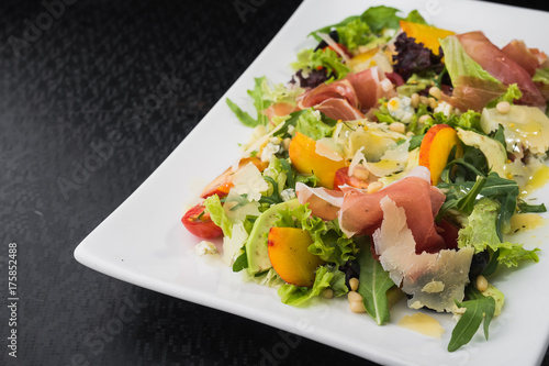 tasty salad with prosciutto