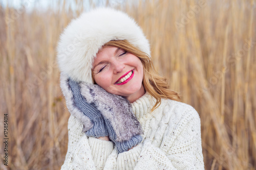 Woman wearing funny and cozy hat and gloves