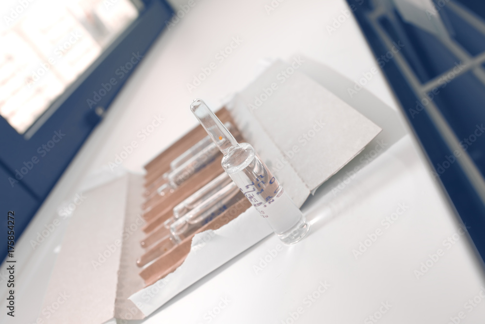 Open package of drug ampoules on the desktop Open package of drug ampoules on the desktop