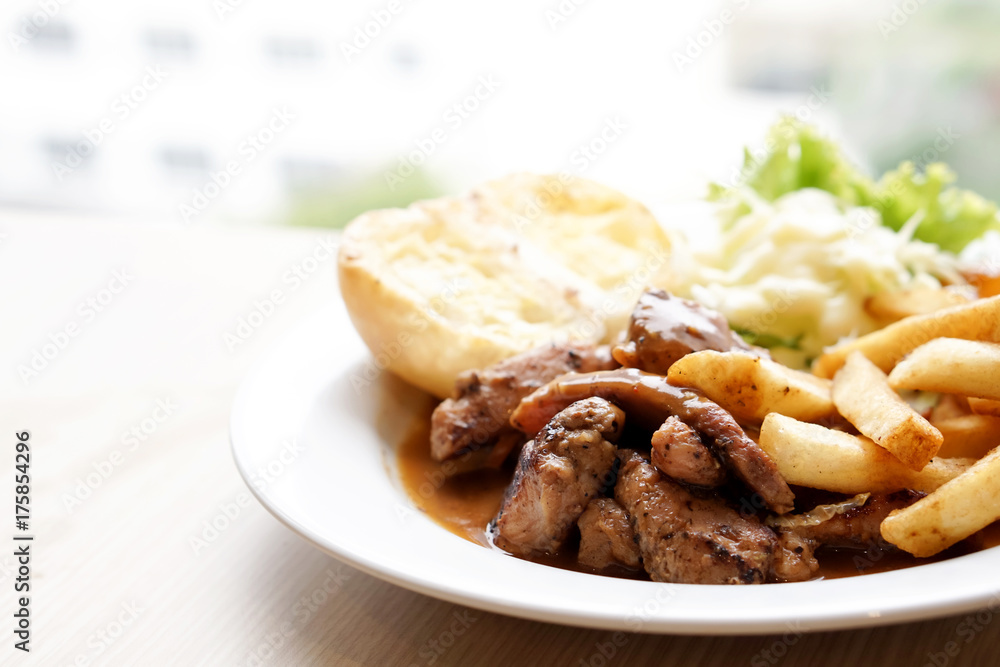 Pepper pork steak with French fried and salad Pepper pork steak with French fried and salad