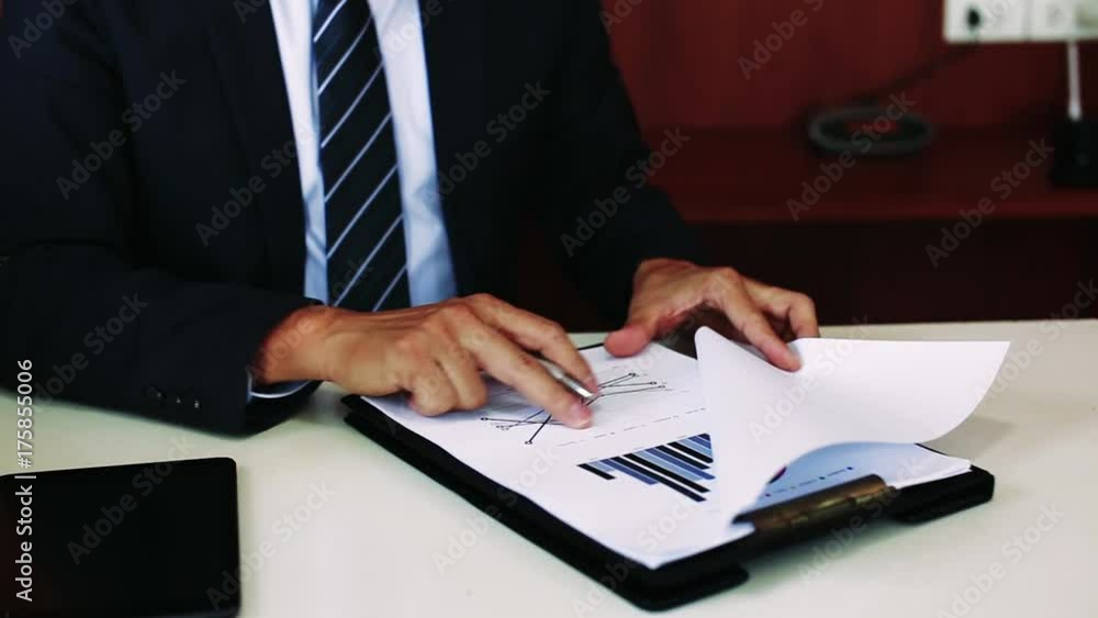 business ideas concept with businessman working with chart analysis paper in office business ideas concept with businessman working with chart analysis paper in office
