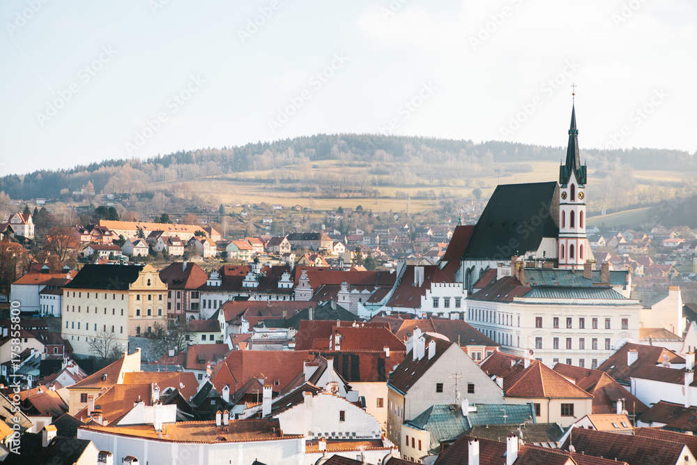 City view of the houses and the Church of St. Vitus in Cesky Krumlov in the Czech Republic. The church is one of the main sights of the town.