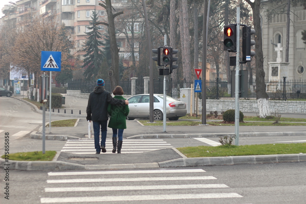 Couple crossing on red light