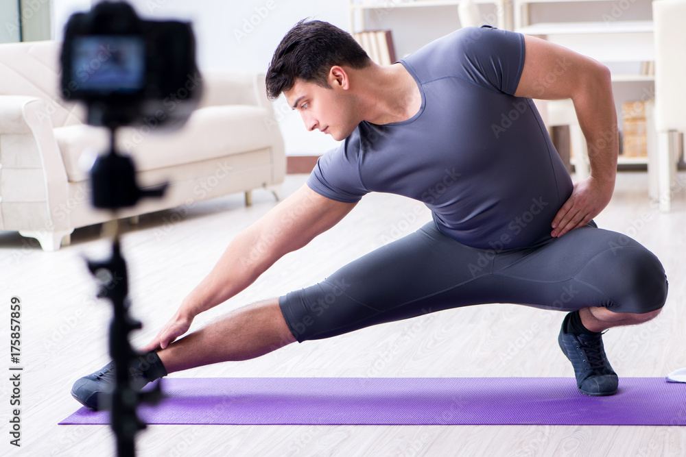 Obraz premium Sports and health blogger recording video in sport concept
