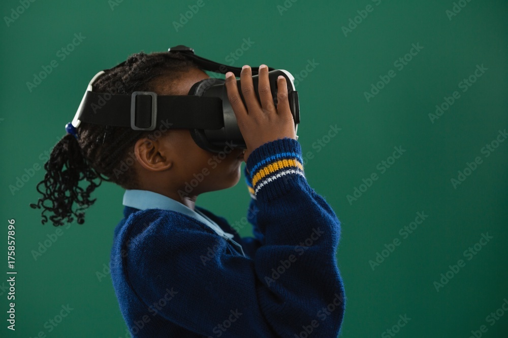 Schoolgirl using virtual reality headset Schoolgirl using virtual reality headset