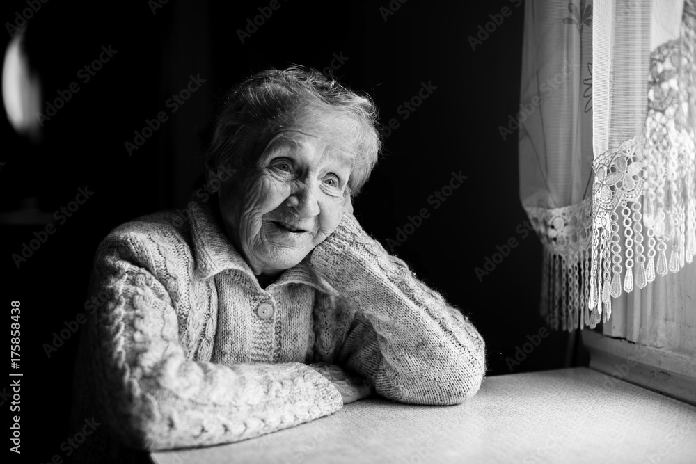 Black and white contrast portrait of an elderly woman.