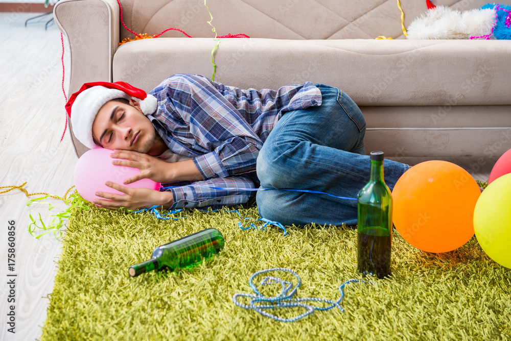 Naklejka premium Man having hangover after christmas party