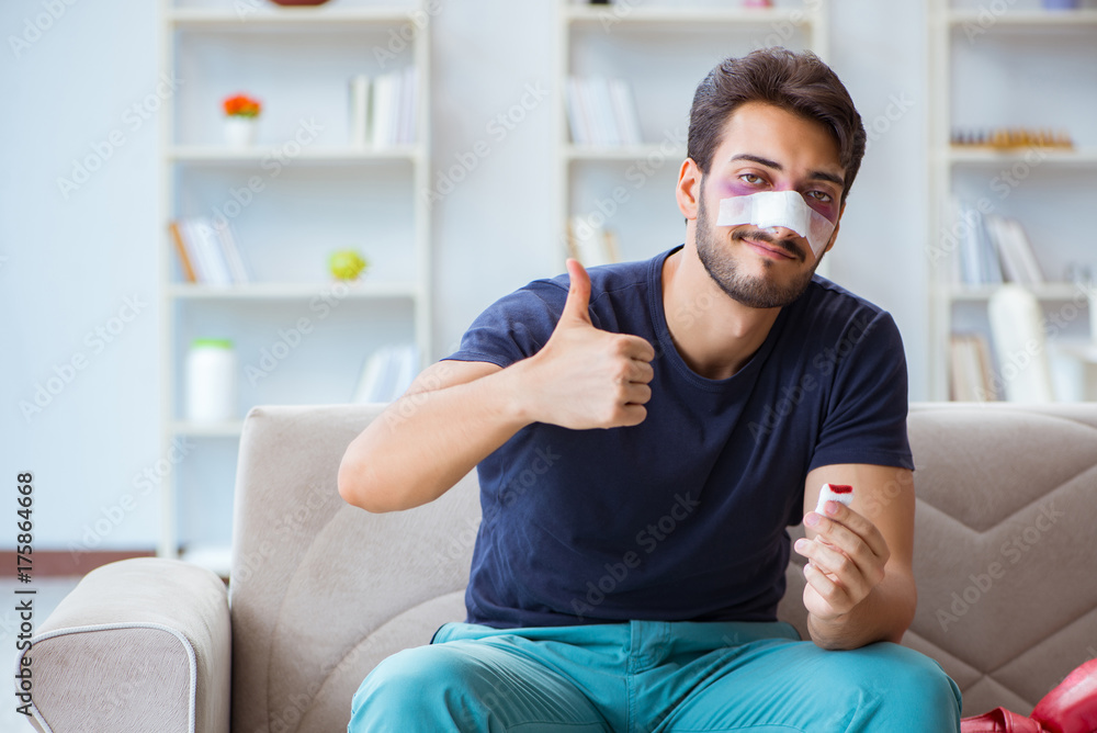 Obraz premium Young man defeated in sports game suffered loss with broken blee