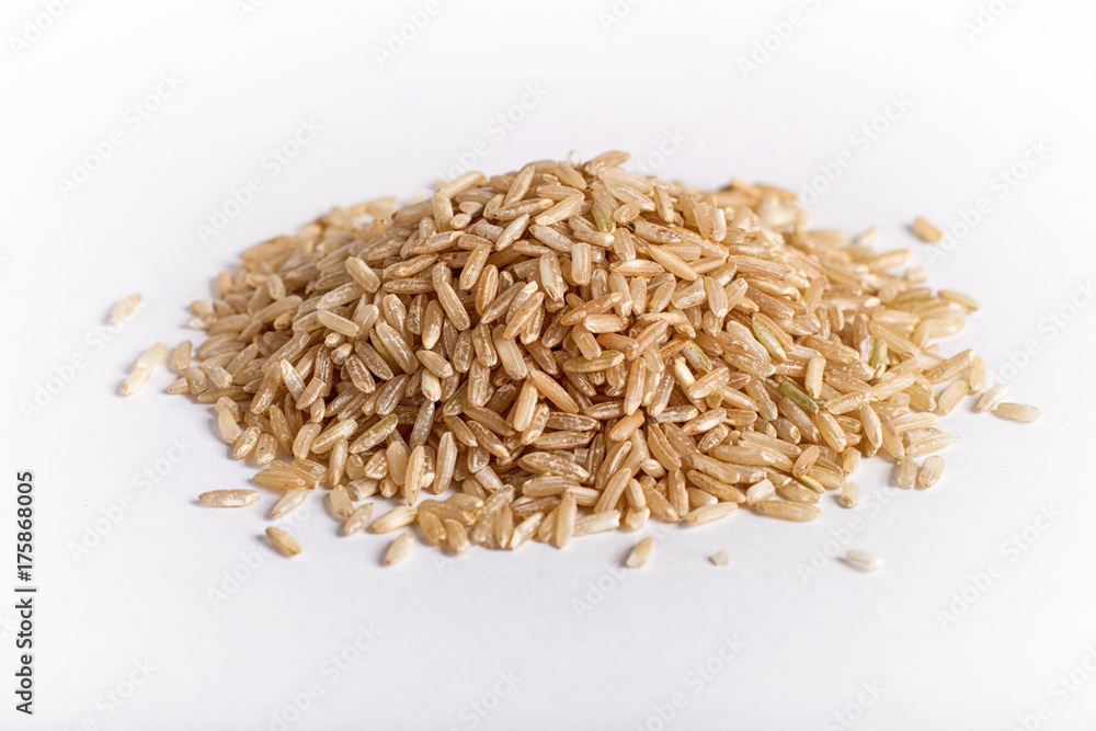 Pile of  brown rice isolated on white background.