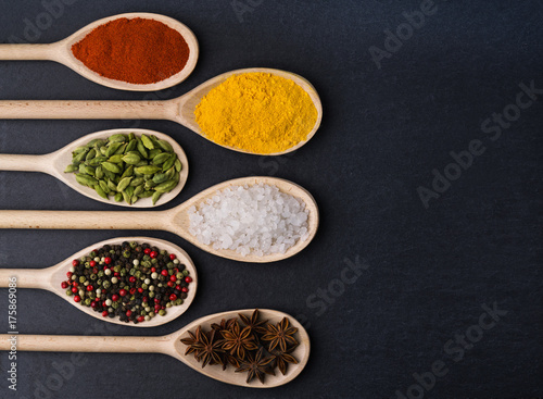 Big set of Indian spices on a black background