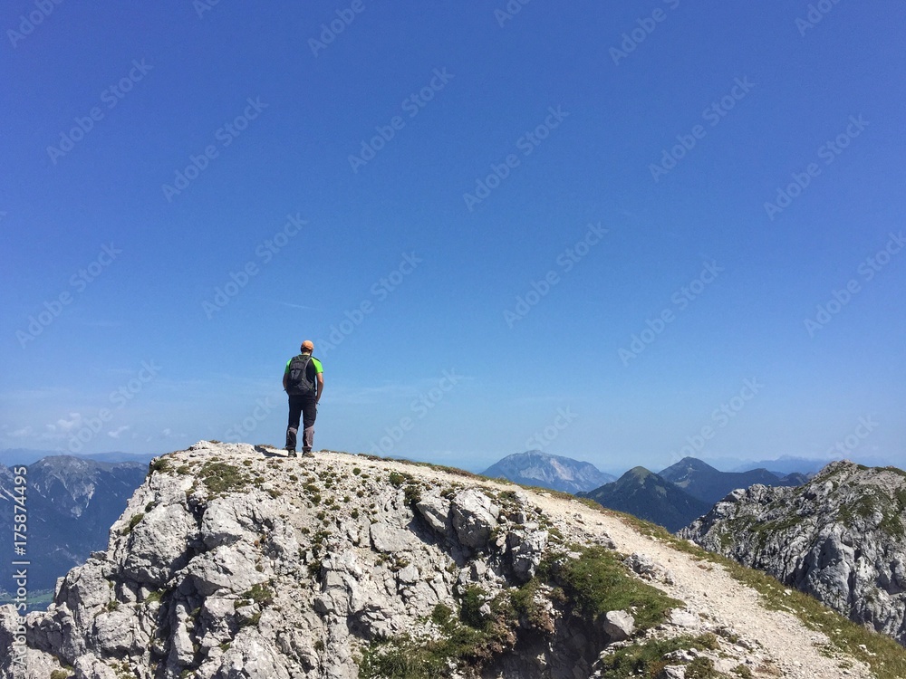 A hiker on the top of a mountain - Gartnerkofel, Carnic Alps, Austria