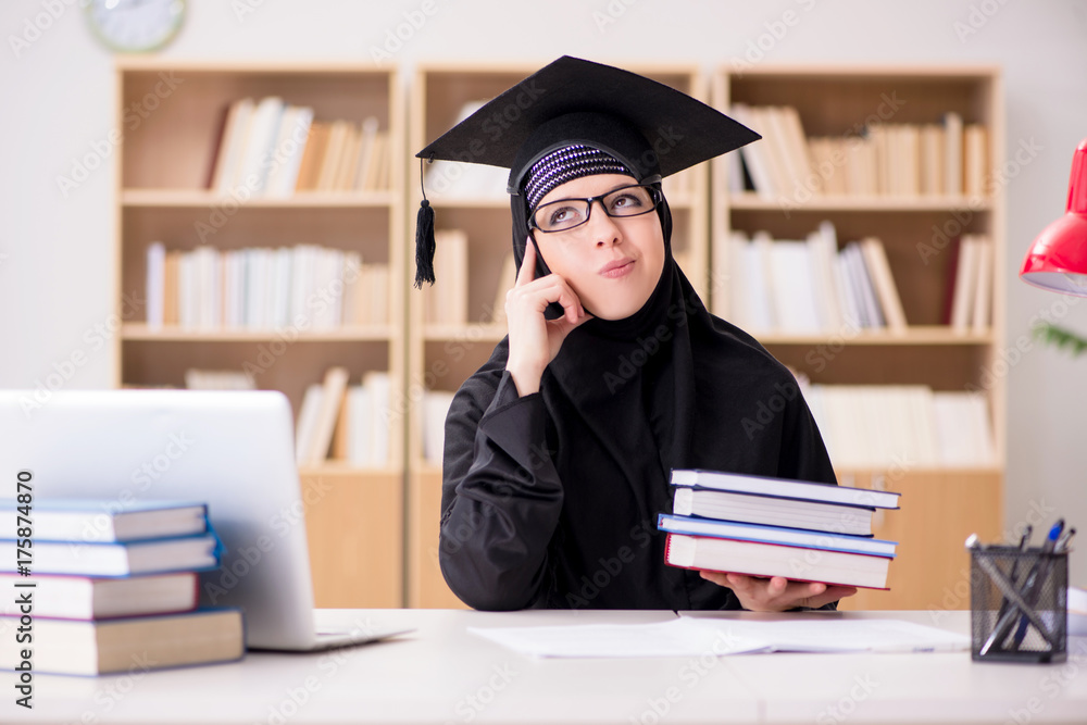 Muslim girl in hijab studying preparing for exams Muslim girl in hijab studying preparing for exams
