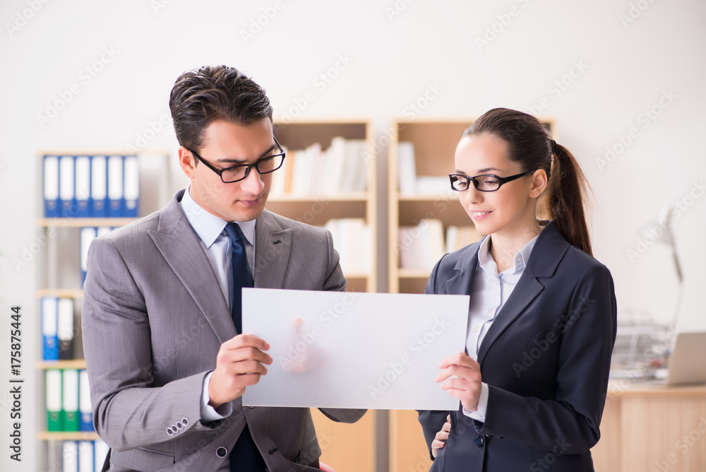 Businessman and businesswoman having discussion in office Businessman and businesswoman having discussion in office