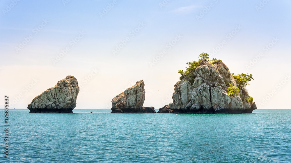 Beautiful natural landscape of small island on the sea under bright blue sky in summer at Mu Ko Ang Thong National Marine Park is a attractions in Surat Thani, Thailand, 16:9 widescreen