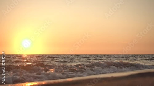 Aerial view of waves crashing on the beach at sunset, Video Shot in Sabaudia, a beautiful beach on the west coast of central Italy.