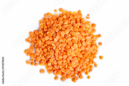 Pile of red lentils isolated on white background.