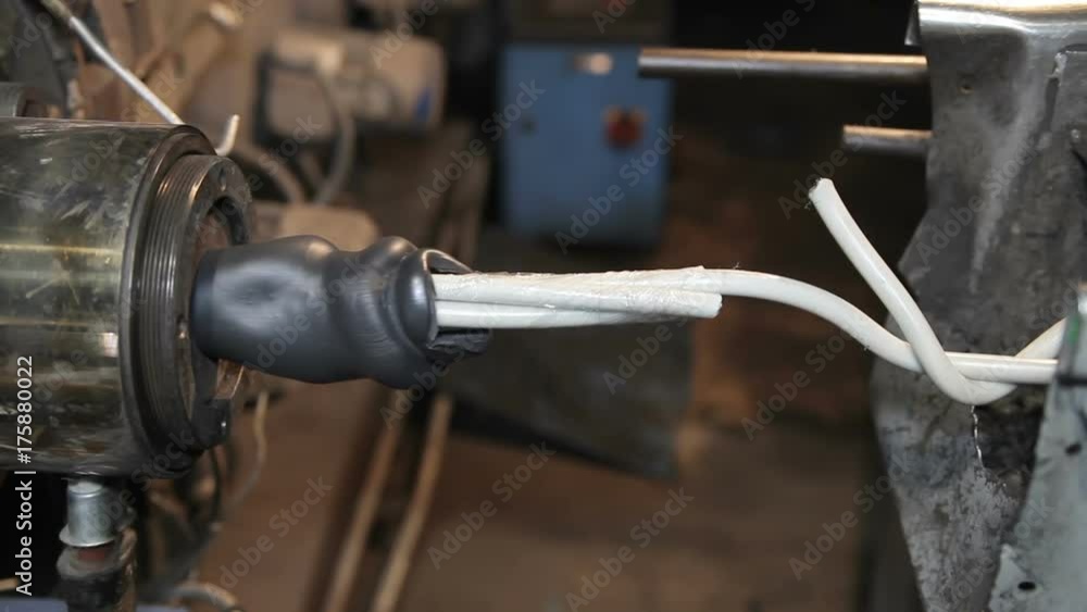 Manufacture of power cable. Applying an insulation layer to the cable Manufacture of power cable. Applying an insulation layer to the cable