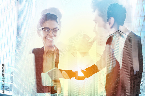 Handshake of two businessperson in office concept of partnership and teamwork.double exposure