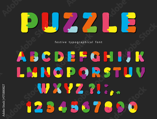 Puzzle font. ABC colorful creative letters and numbers on a black background.