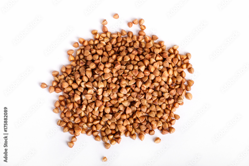 Pile of buckwheat isolated on white background. Pile of buckwheat isolated on white background.