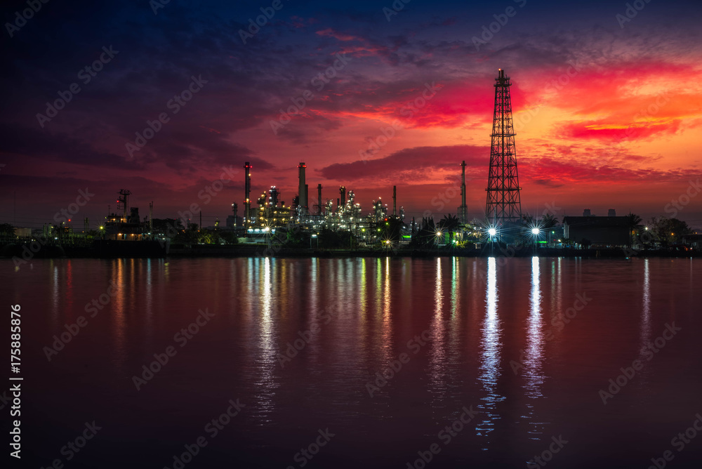 Fototapeta premium Oil and gas industry - refinery at Sunrise - factory - petrochemical plant with reflection over the river