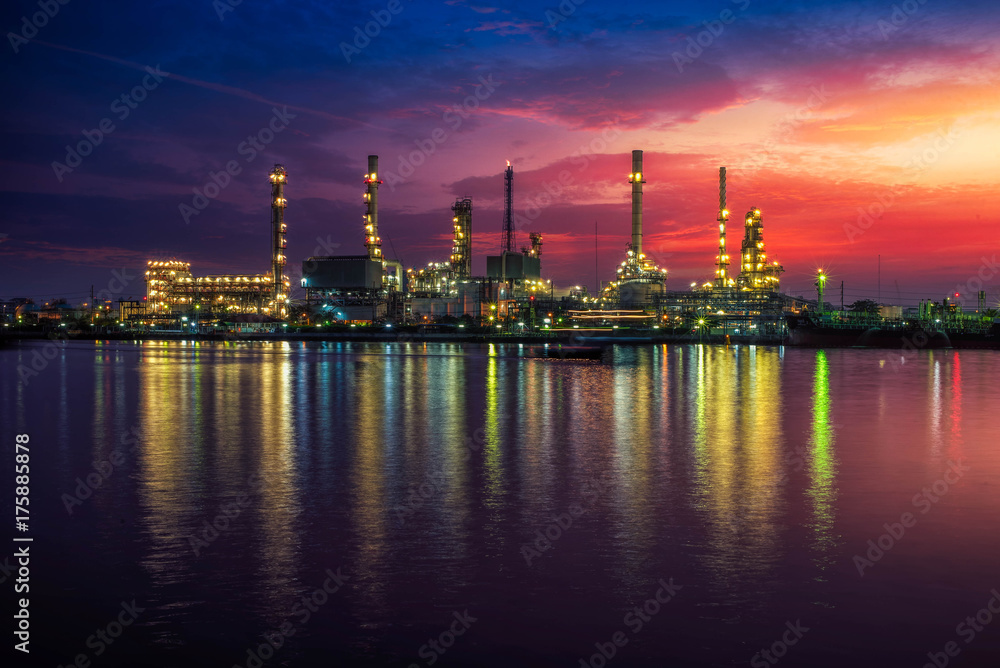 Oil and gas industry - refinery at Sunrise - factory - petrochemical plant with reflection over the river