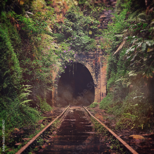Spooky misty entrance to an abandoned historic railway tunnel in Helensburgh, New South Wales, Australia