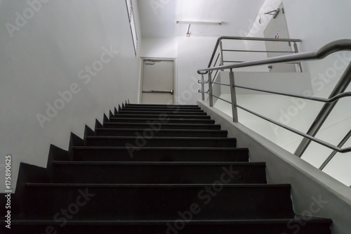 Old staircase with a handrail in a building