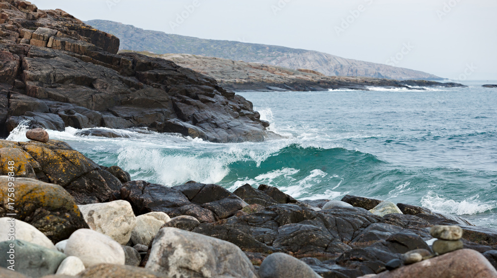The coast, with stone boulders. Barents sea, Russia.