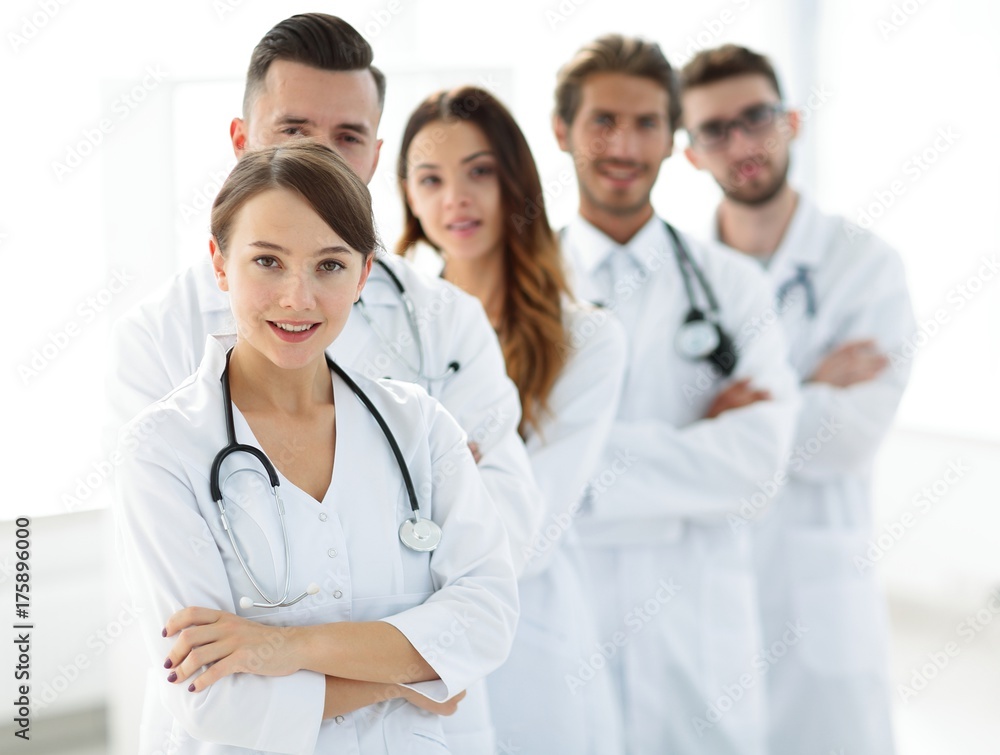 Fototapeta premium woman-pediatrician on the background of colleagues