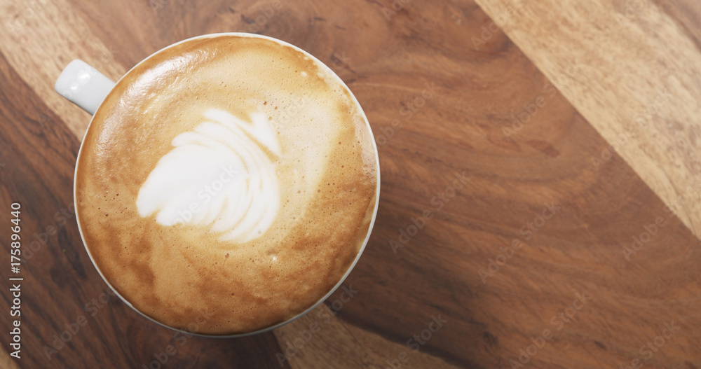top view cappuccino on wood table top view cappuccino on wood table
