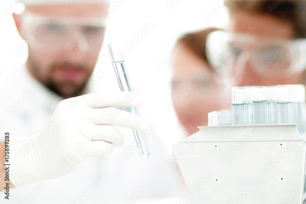 closeup of a group of scientists and pharmacists in the laboratory. closeup of a group of scientists and pharmacists in the laboratory.