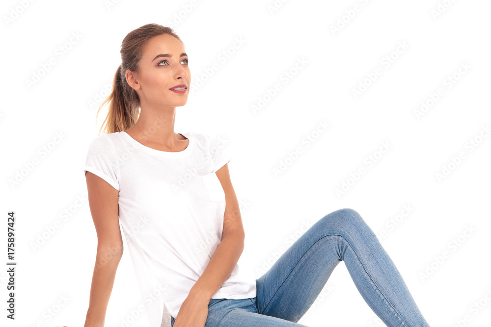 casual young blonde woman resting and looking up casual young blonde woman resting and looking up