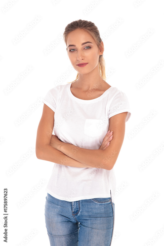 smilling and confident young casual woman standing with arms folded smilling and confident young casual woman standing with arms folded