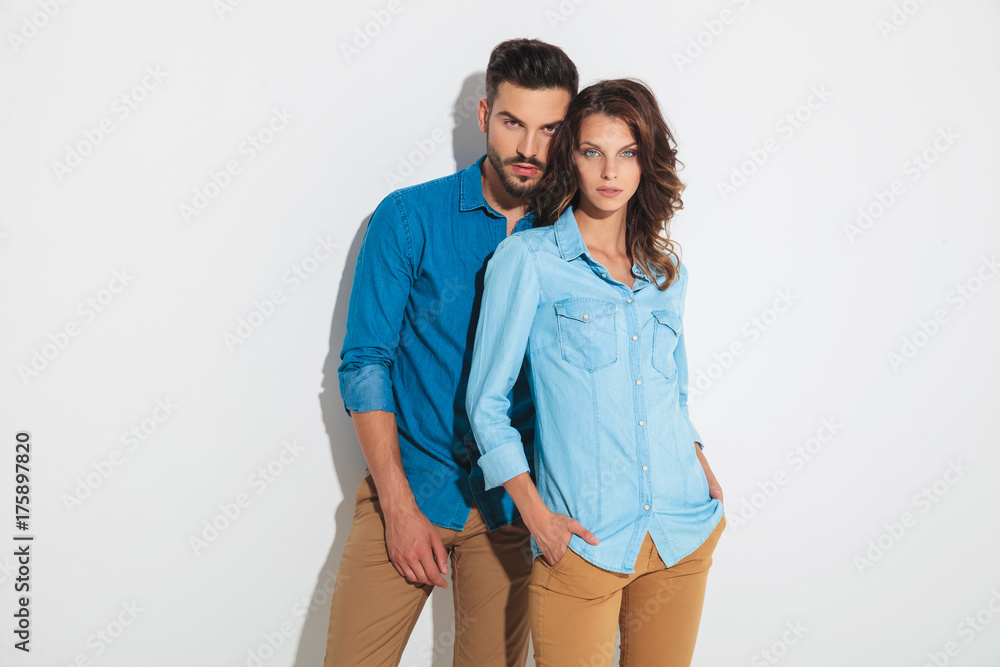 young casual couple posing for the camera young casual couple posing for the camera