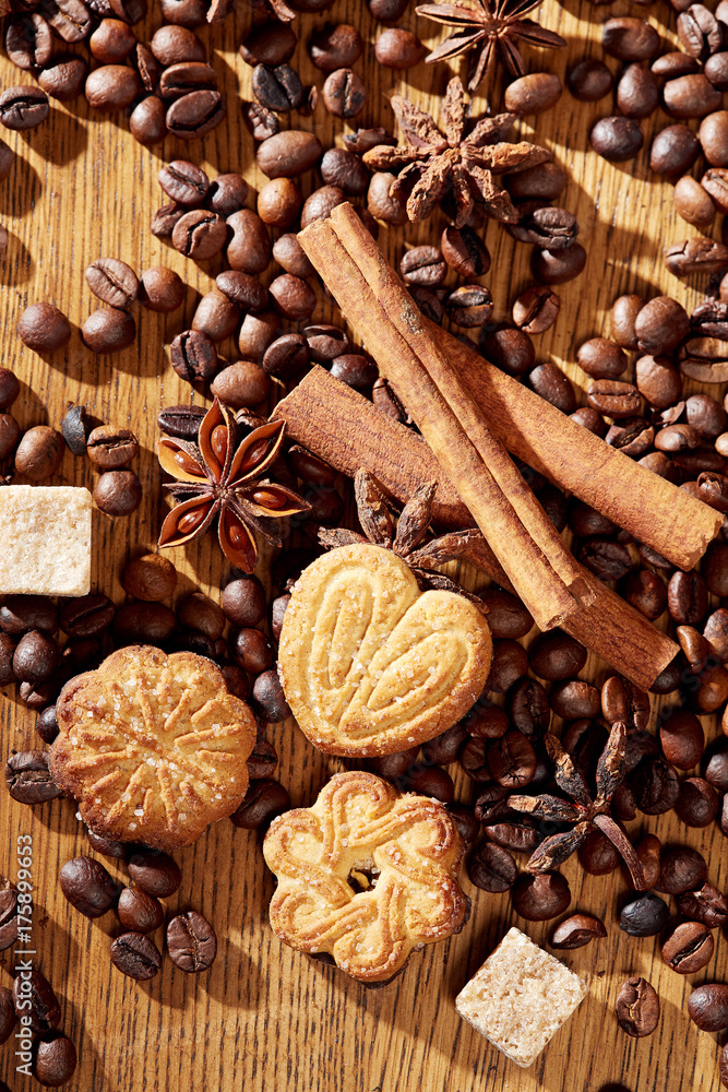 Aroma coffee chocolate cookies and spices on the wooden table. Dark wooden background. Top view. Close. Closeup. Aroma coffee chocolate cookies and spices on the wooden table. Dark wooden background. Top view. Close. Closeup.