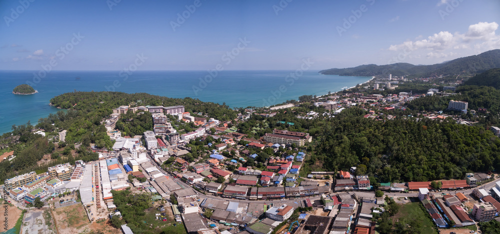 Naklejka premium Blue Sky Over Karon Town And Beach In Phuket, Thailand, Aerial Drone Panoramic Shot