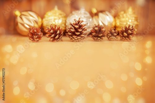 Pine cones on wooden background.