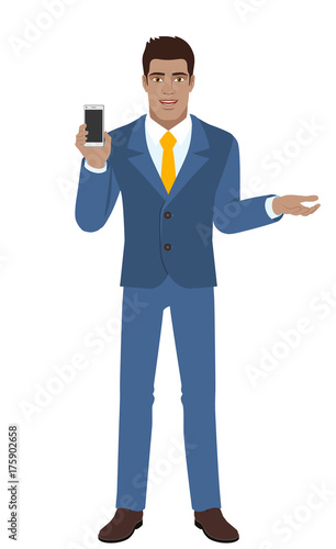 Businessman holding mobile phone and  gesturing