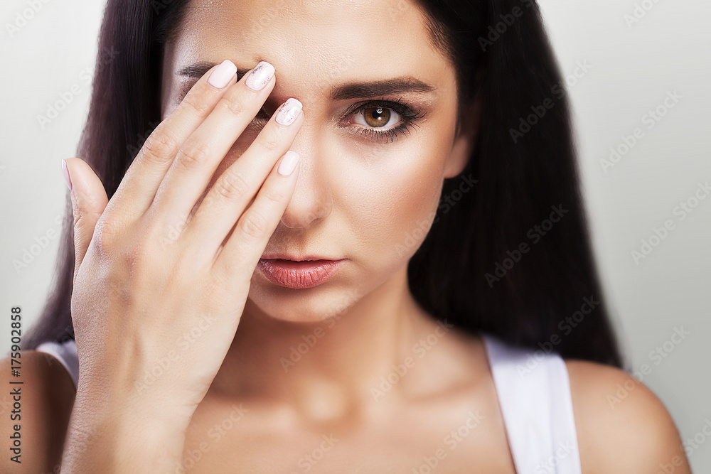 Headache and severe stress. experience. Painful feelings in the head. Fatigue. The concept of health. On a gray background. Headache and severe stress. experience. Painful feelings in the head. Fatigue. The concept of health. On a gray background.