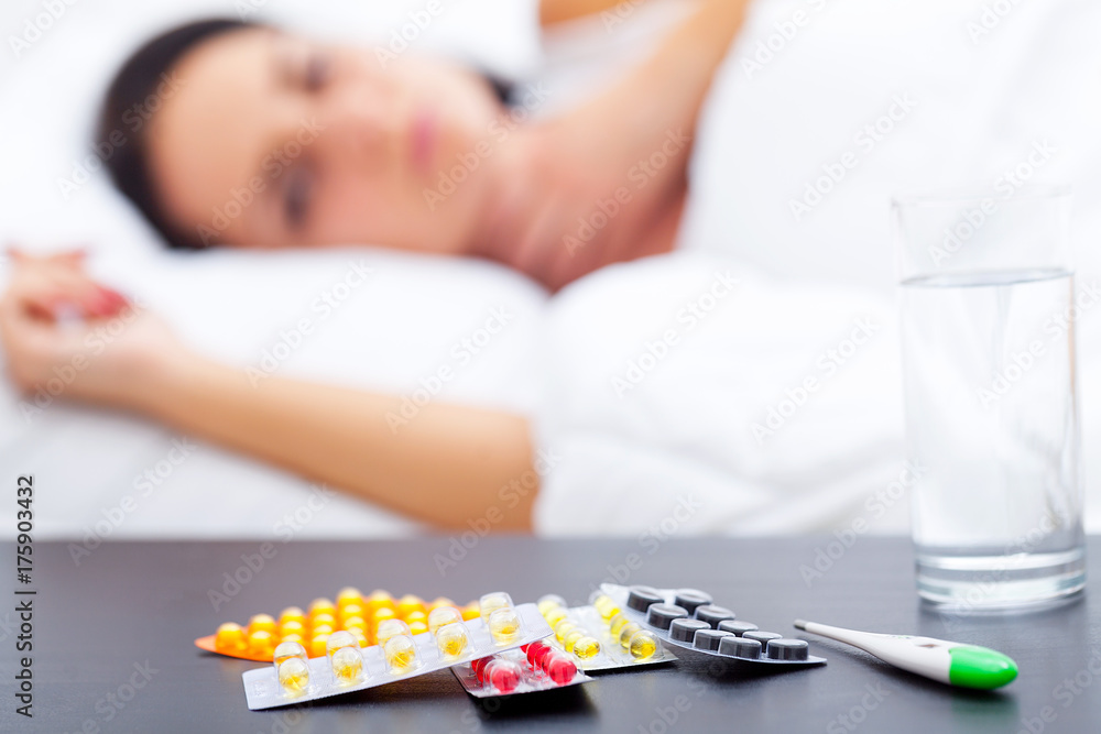 Ill Woman Caught Cold, Having Fever And Measuring Temperature With Thermometer. Portrait Of Sick Girl With Sore Throat Covered In Blanket Having Health Problem. Illness Concept. High Resolution Ill Woman Caught Cold, Having Fever And Measuring Temperature With Thermometer. Portrait Of Sick Girl With Sore Throat Covered In Blanket Having Health Problem. Illness Concept. High Resolution