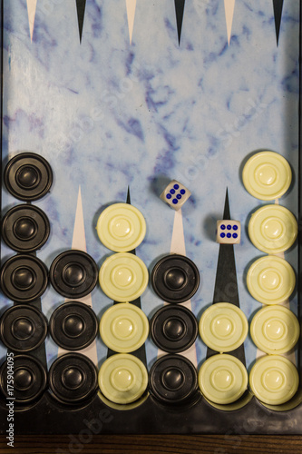 Game field in a backgammon with dice and checkers