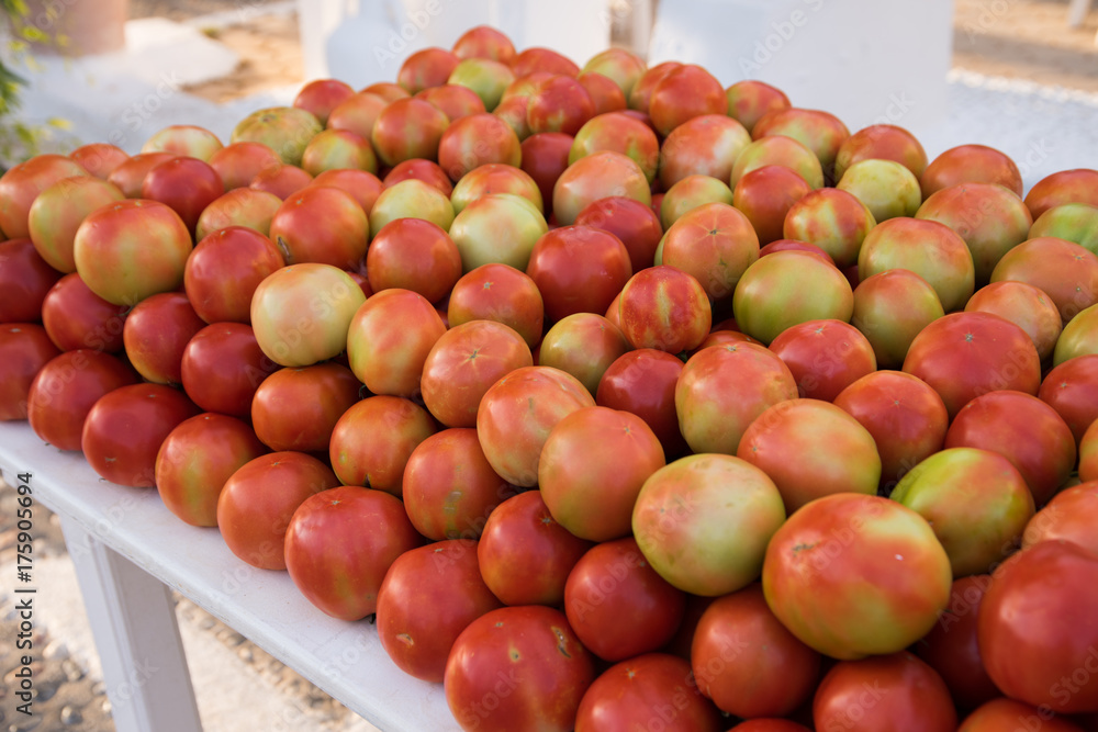 Eco-friendly farmer tomatoes are laid out on the table for sale. Crete, Greece.